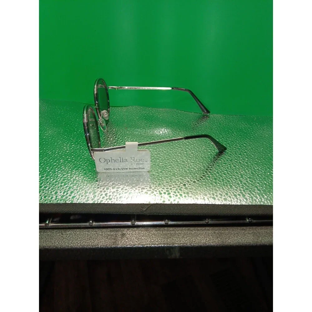 Ophelia Roe sunglasses with a black round frame and silver-tone metal temples